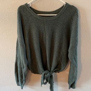 Sweater with cute front tie.  Never worn in perfect condition